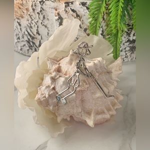 Vintage Girl Golfer silver tone brooch.